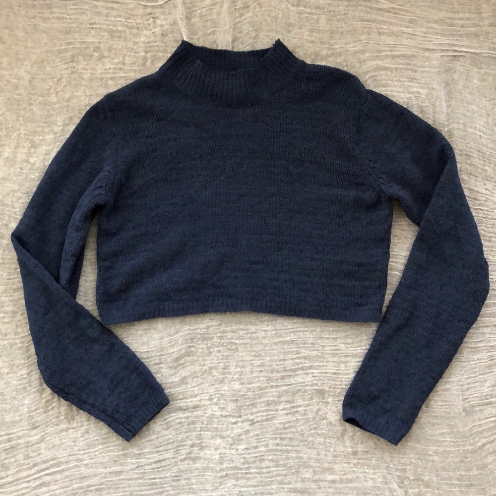 Navy blue cropped sweater.